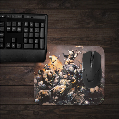 The Destroyer mousepad in a gaming setup, featuring an epic battle scene by Frazetta